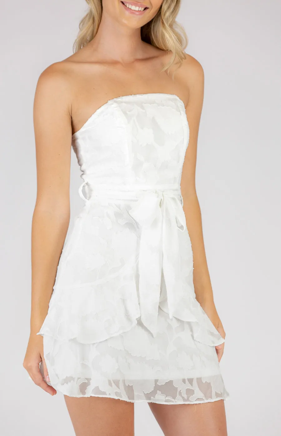 Hot little White Strapless Mini Dress with Frill Hem Details