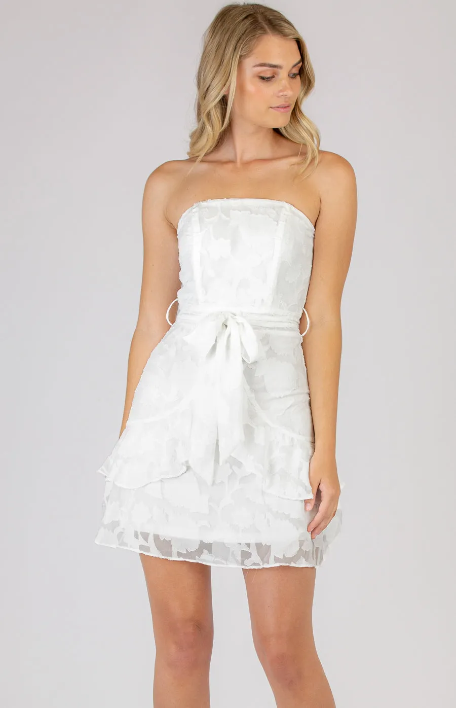 Hot little White Strapless Mini Dress with Frill Hem Details